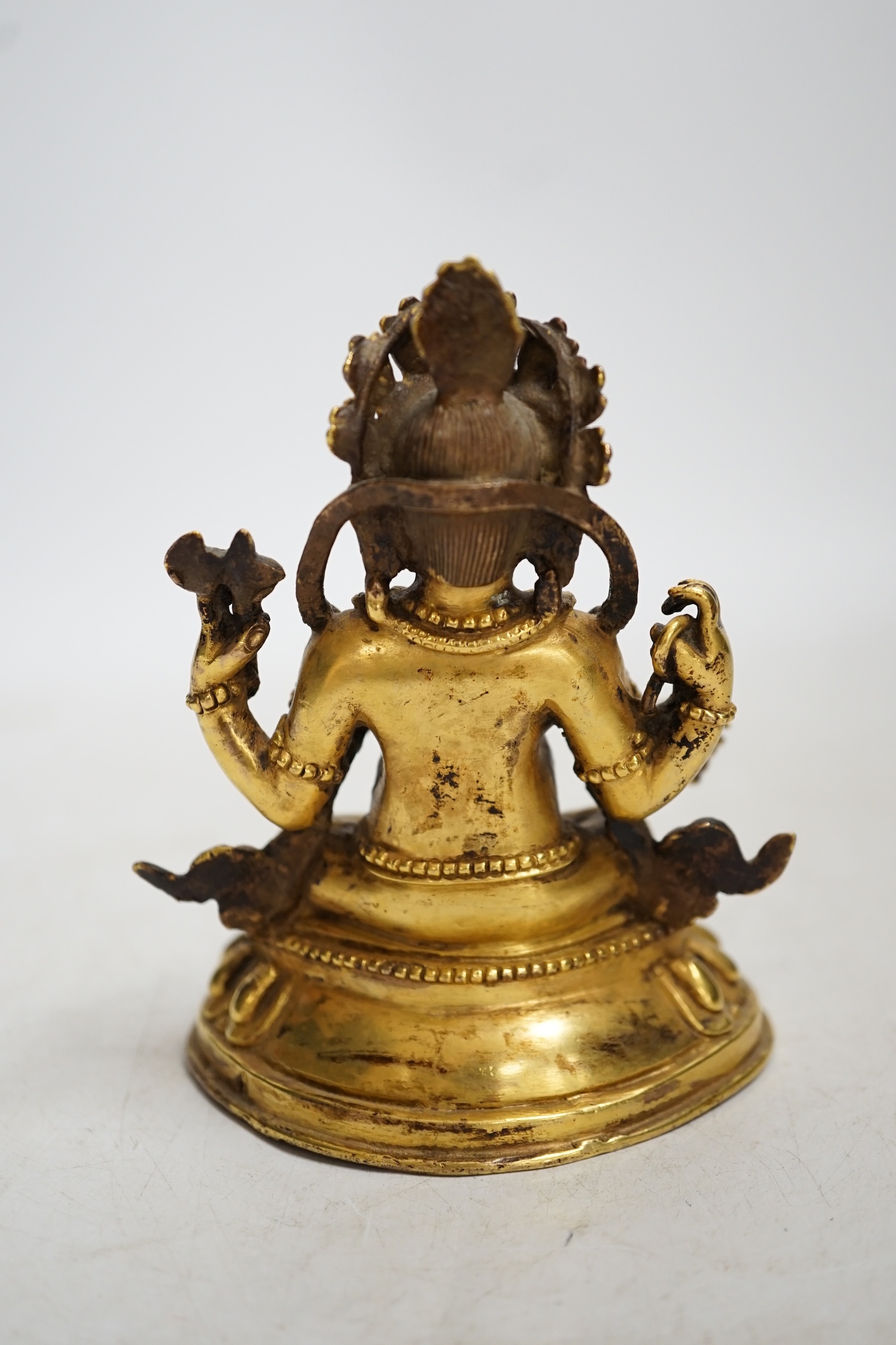 A gilt bronze figure of Ganesha, 13cm high. Condition - fair